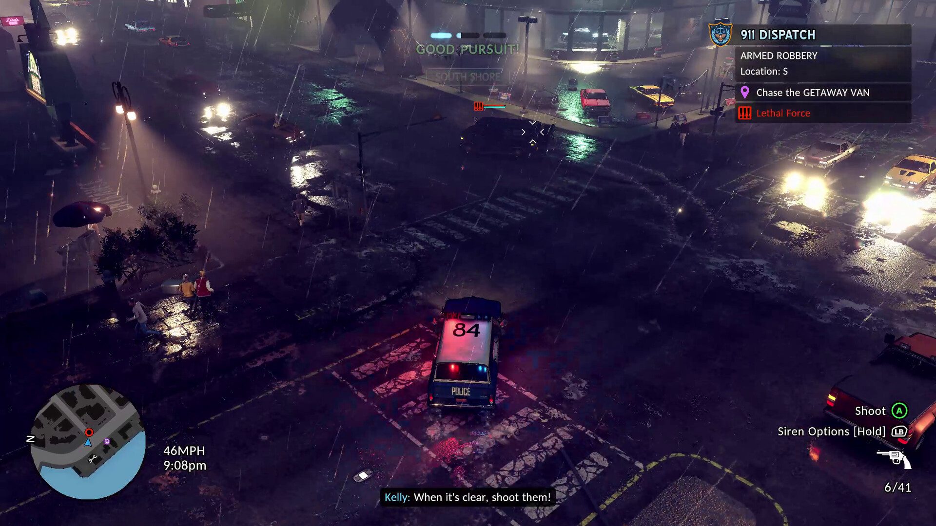 Police car chasing a getaway van at night in heavy rain